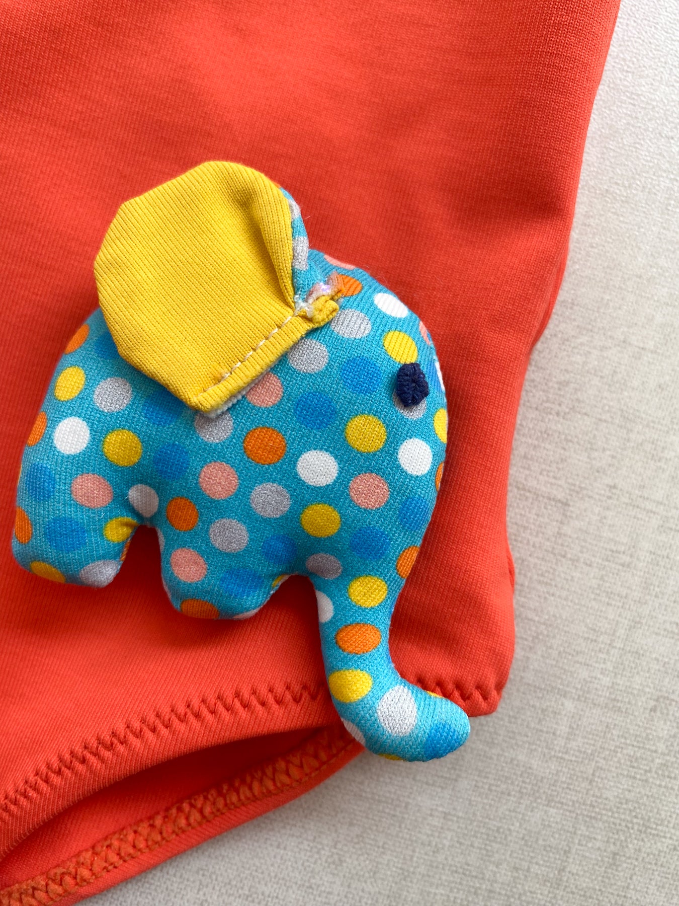 Orange Swimsuit with Pop Up Toy